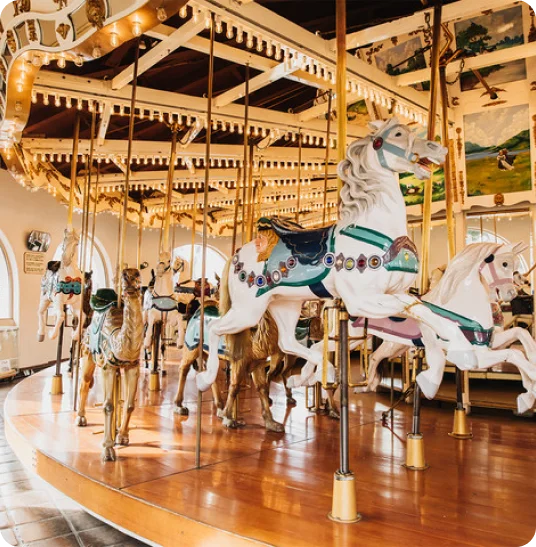 An empty carousel with classic carousel horses