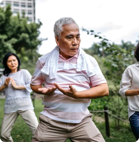 Elderly couple doing exercise in the park.